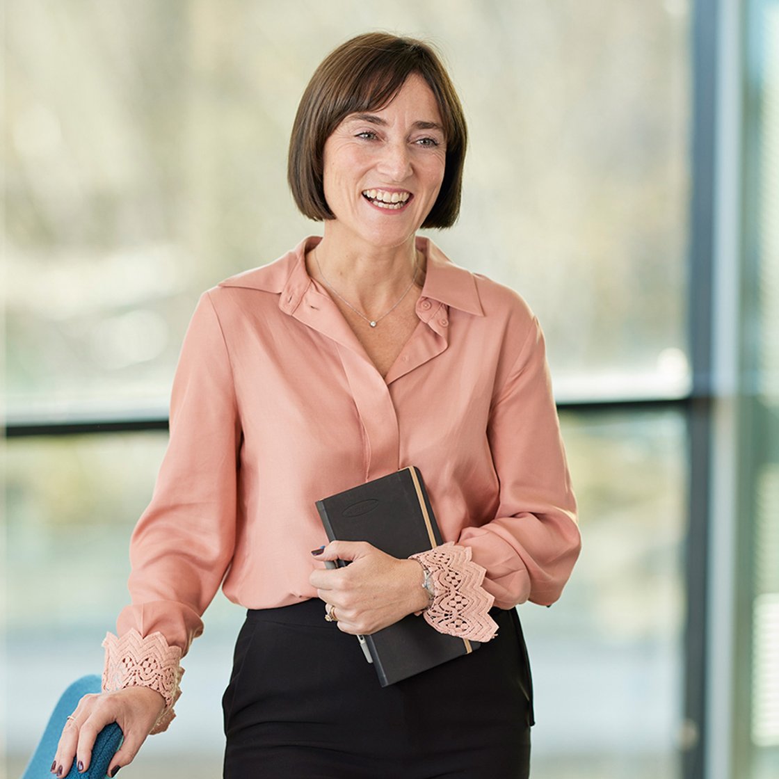 Lorna Kennedy stood clutching a notebook in the Baillie Gifford office.