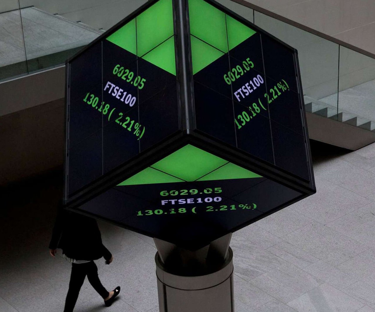 Cube shaped display inside the London Stock Exchange showing prices.