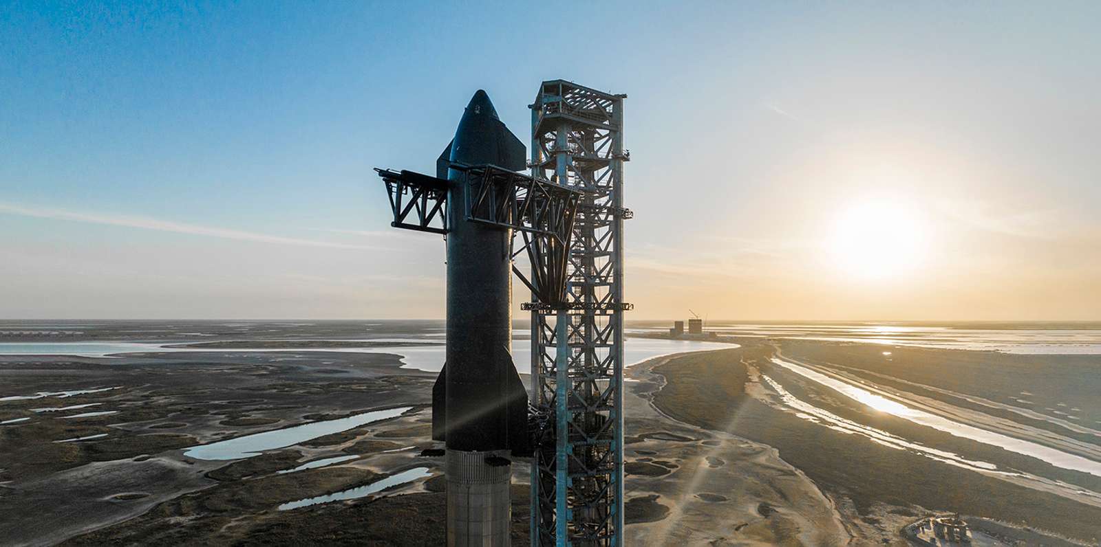 Space X Starship sat on the launch pad.
