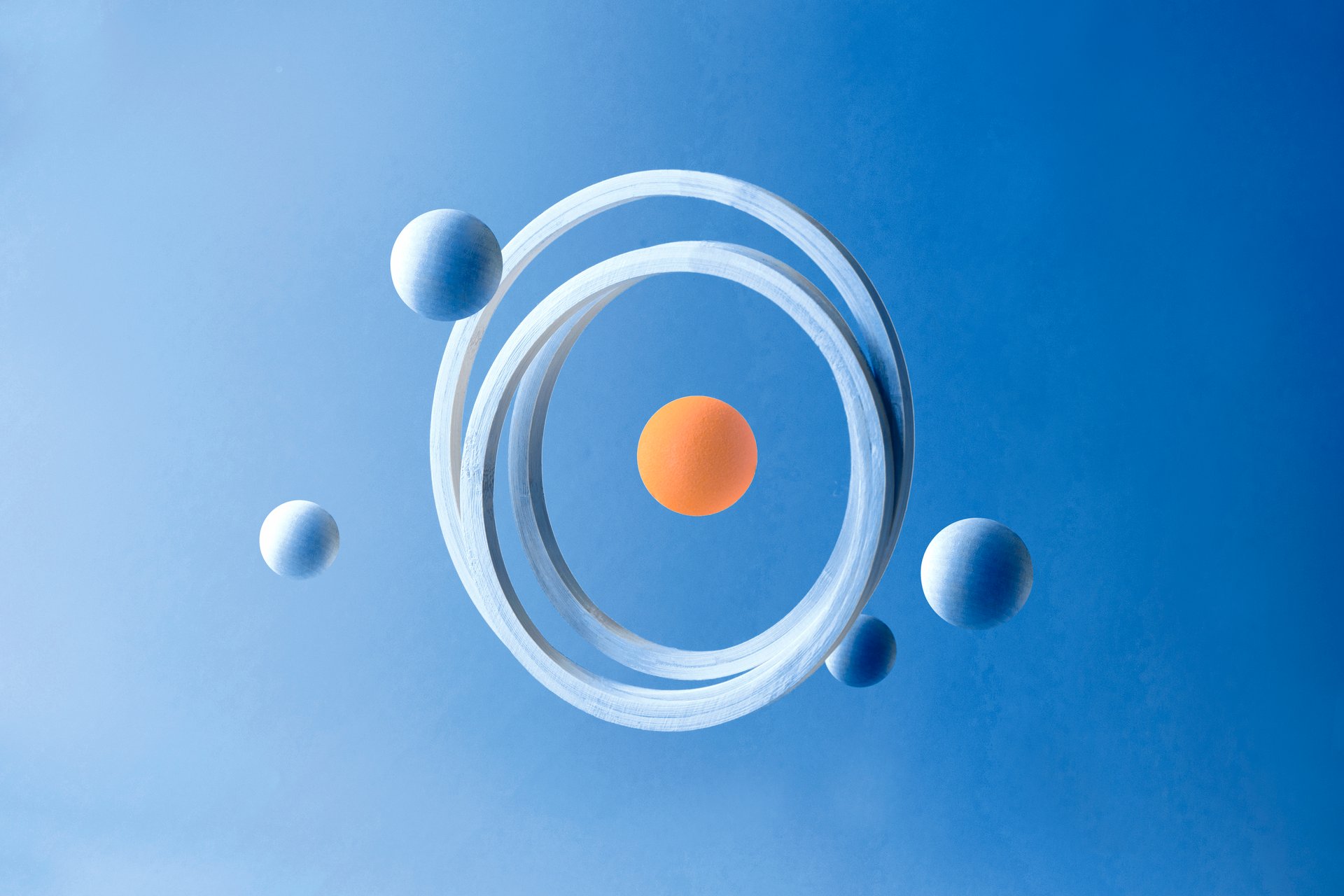 Abstract of blue and oranges spheres with circle hoops.