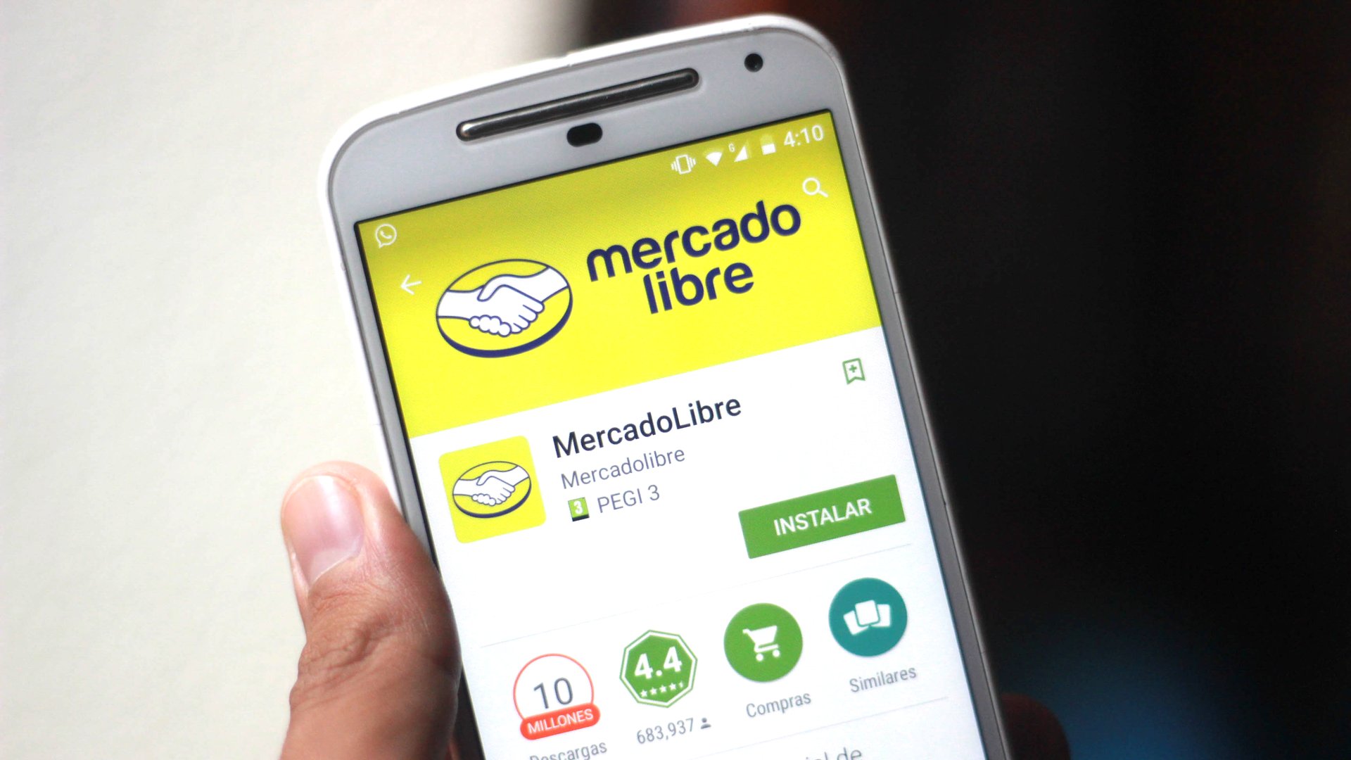 MercadoLibre application are displayed in the app store on a mobile phone.