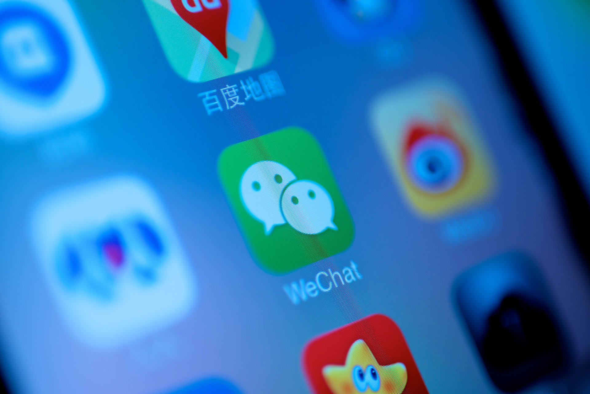 Close up of the WeChat app icon on a mobile phone screen.