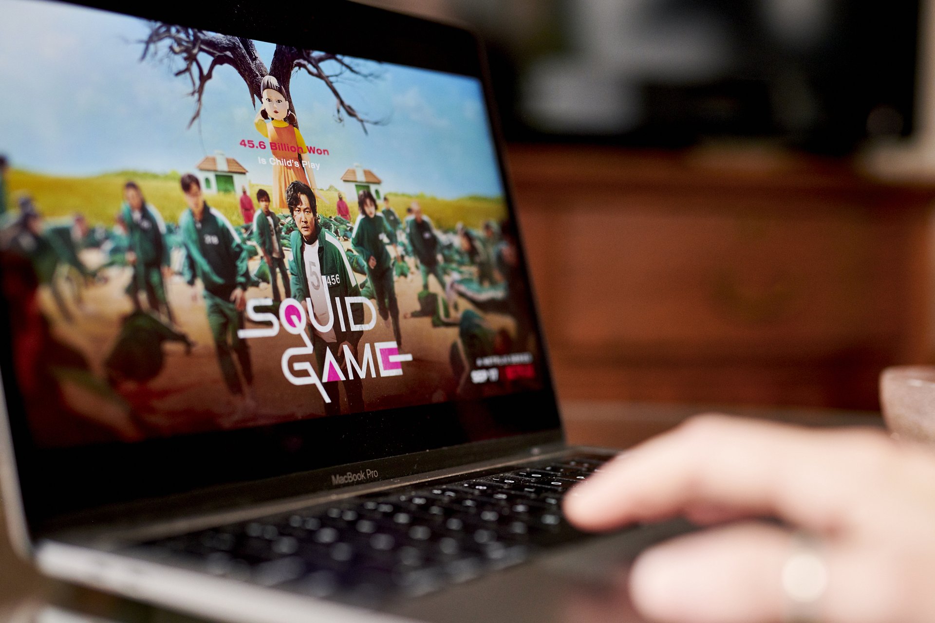 Close up of a laptop displaying a promo for the Netflix show Squid Game.
