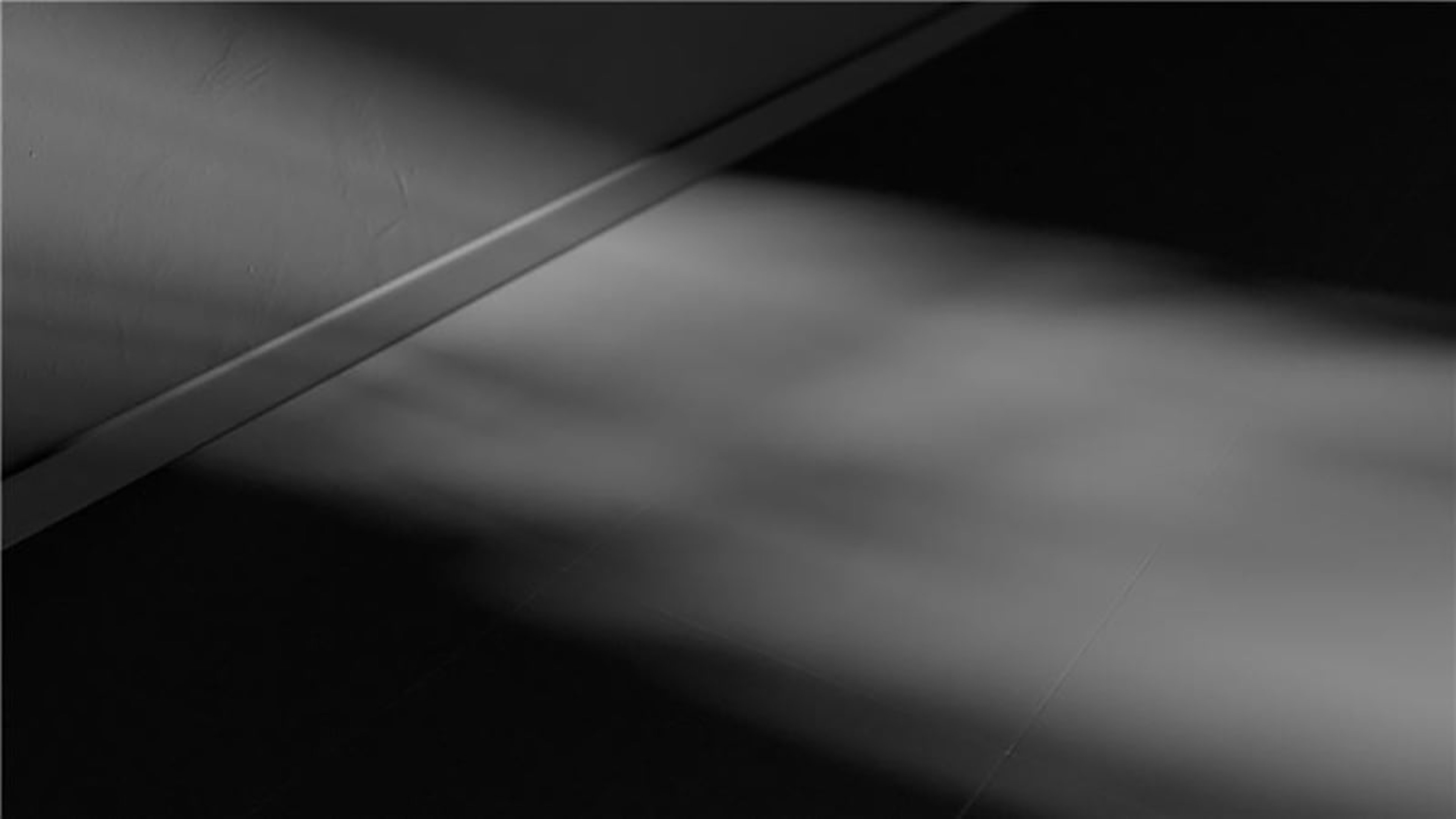 Monochrome shapes on a black background