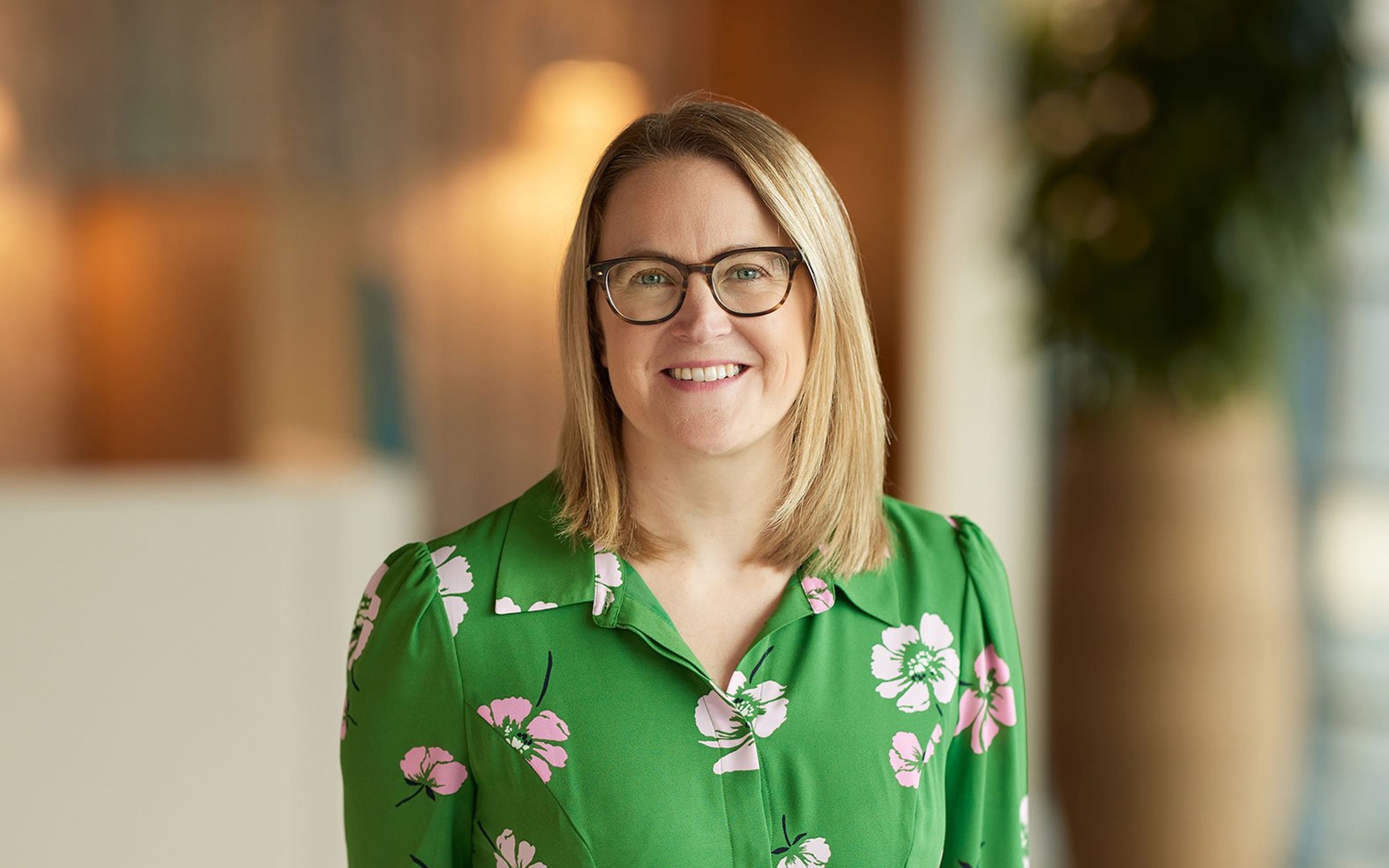 Lyndsay Cooper stood in the Baillie Gifford office.