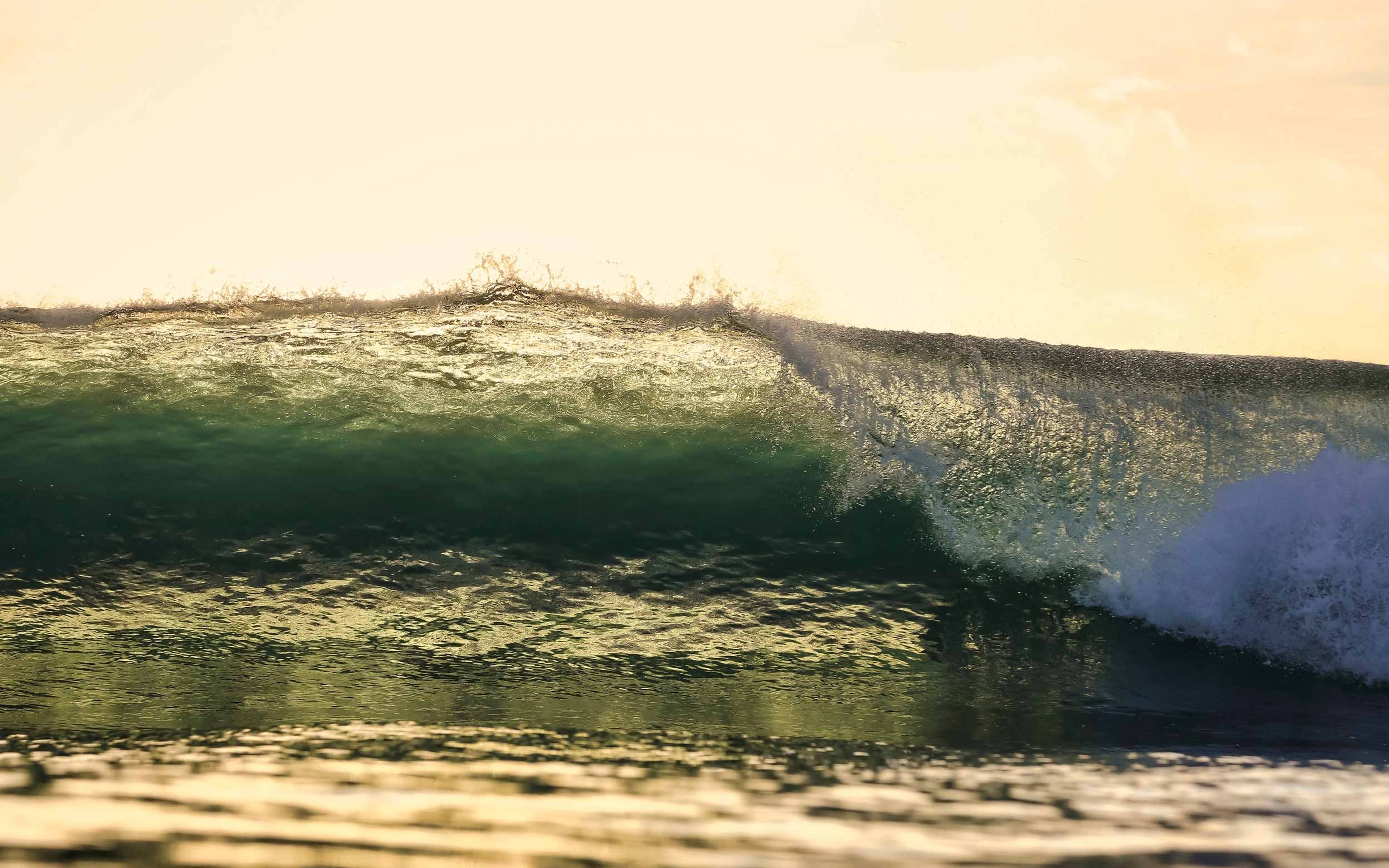 Ocean wave at sunset time, Indian Ocean, Maldives.