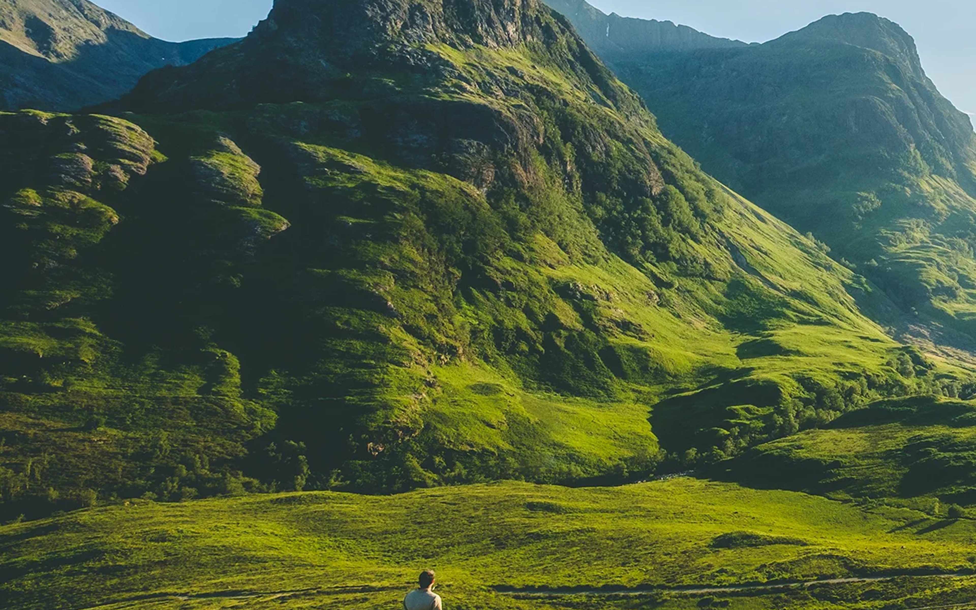 A person views the peaks of Glencoe, Scotland