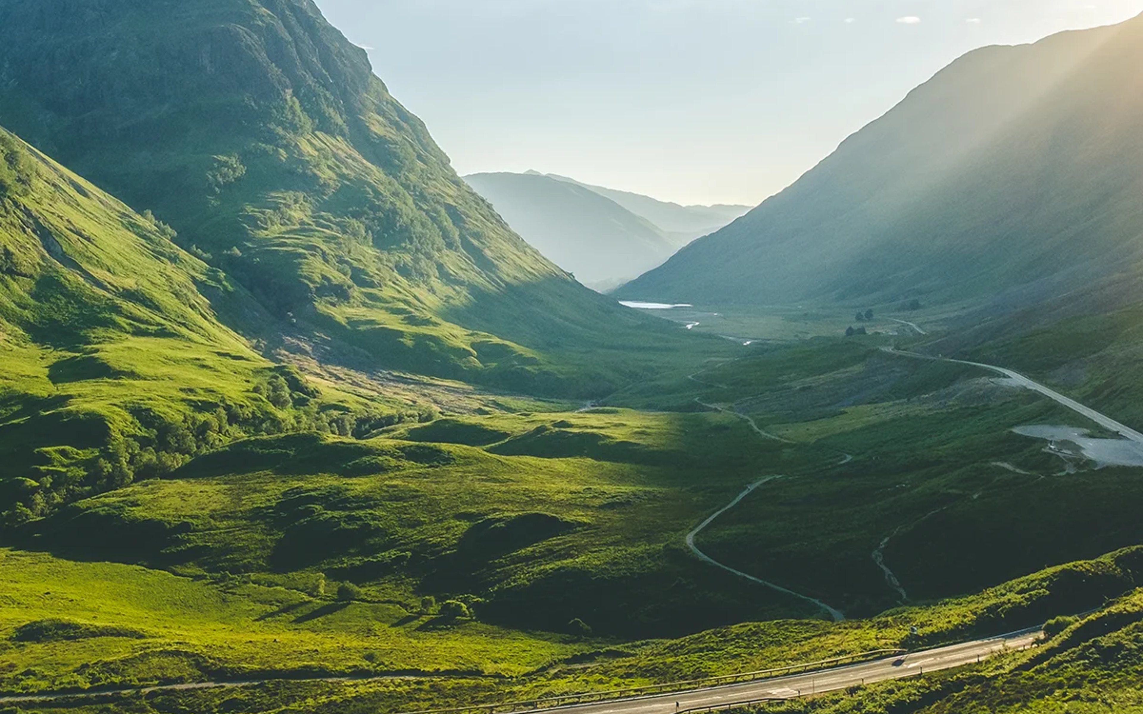 The sun shines through Glencoe, Scotland