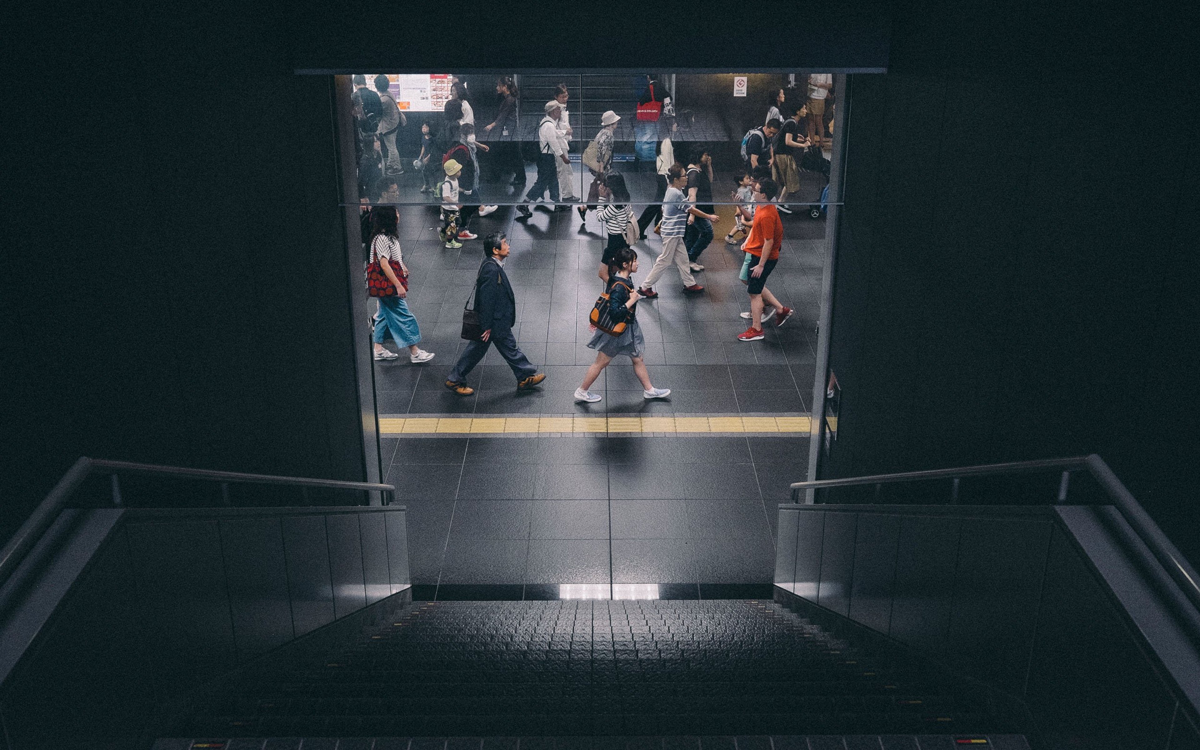 High angle view of people walking at subway station in Kyoto, Japan.