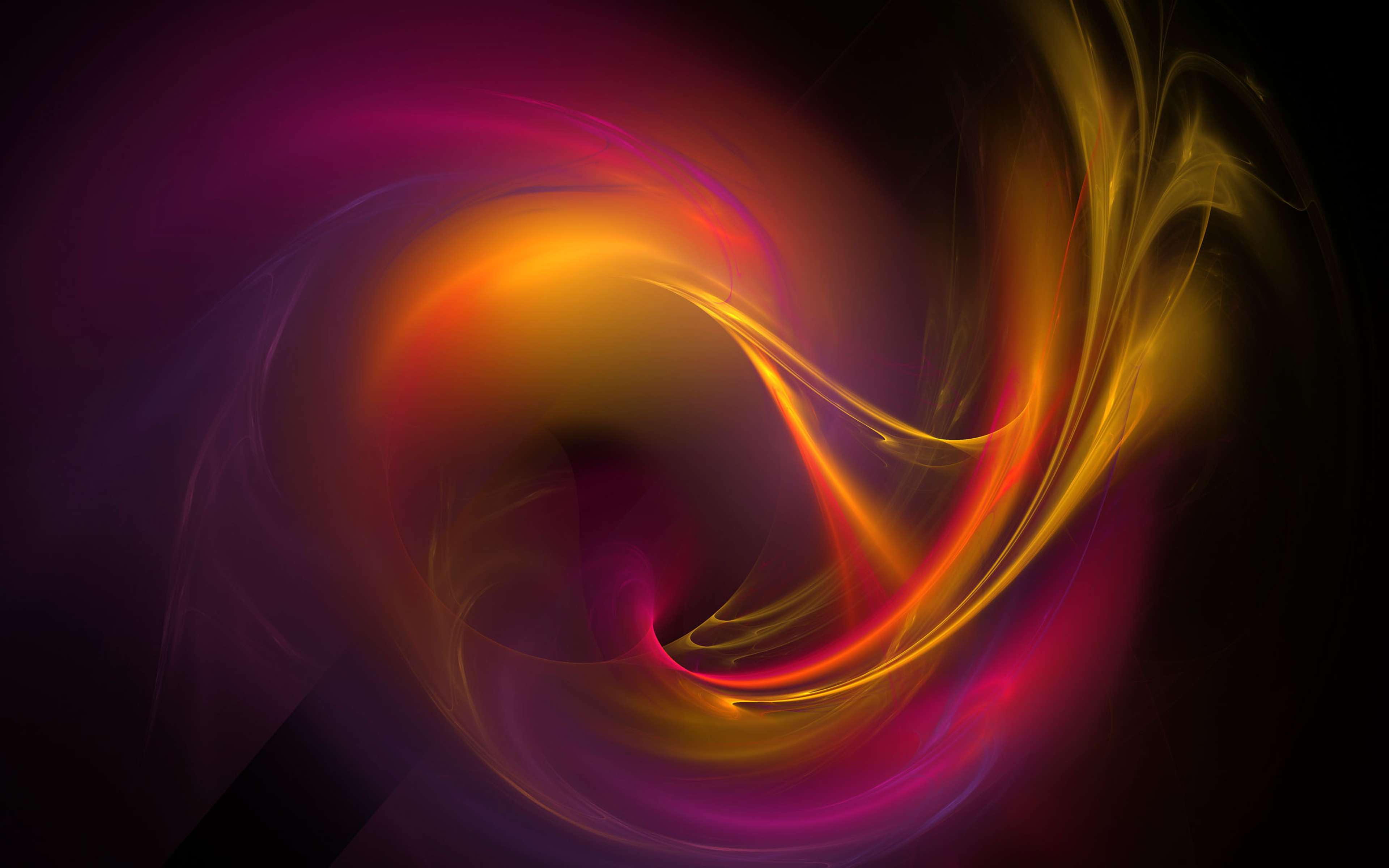 An abstract image of swirling blurred orange, purple and pink light over a black background.