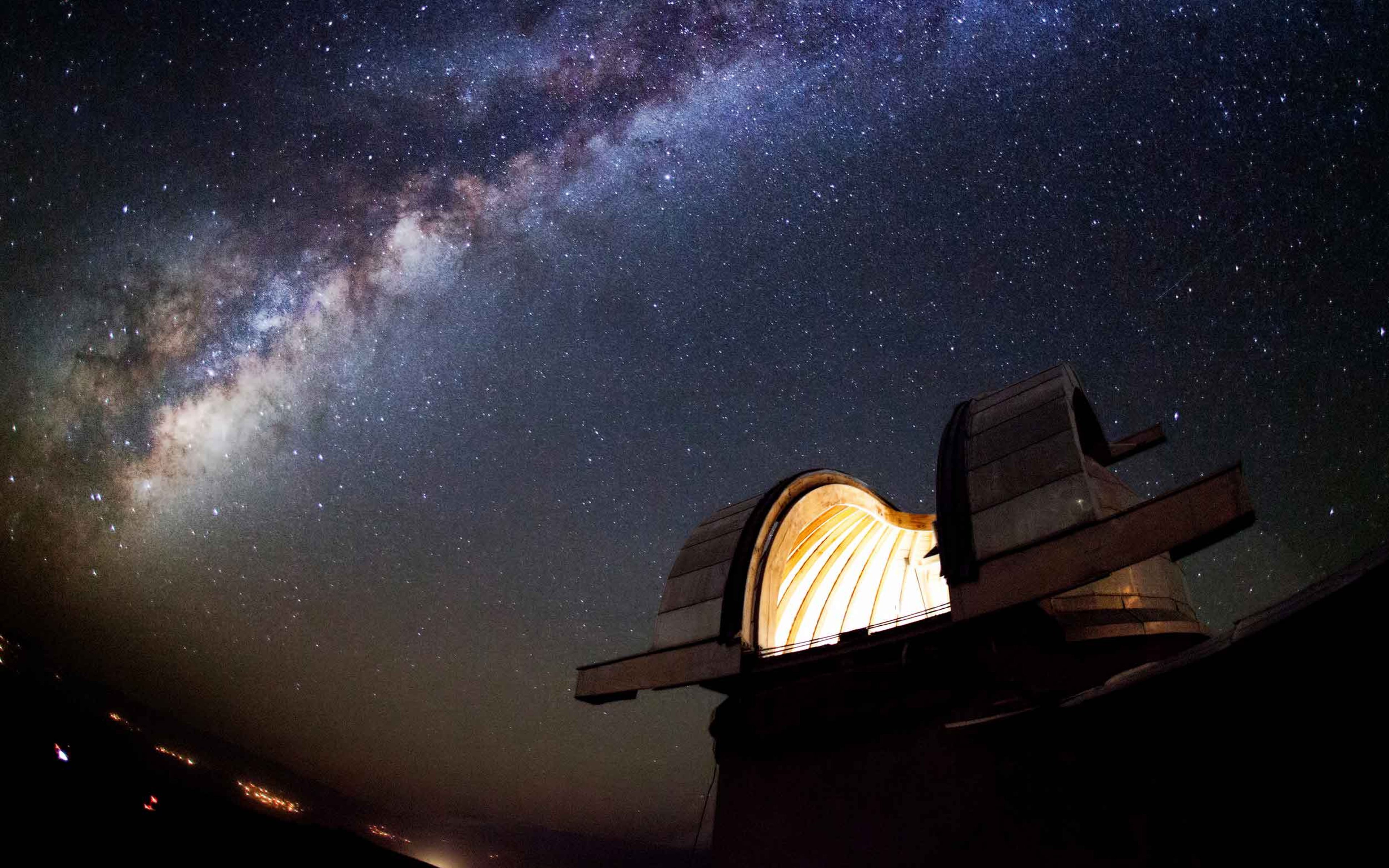 Astronomical Observatory under the starlit sky filled with the milky way.