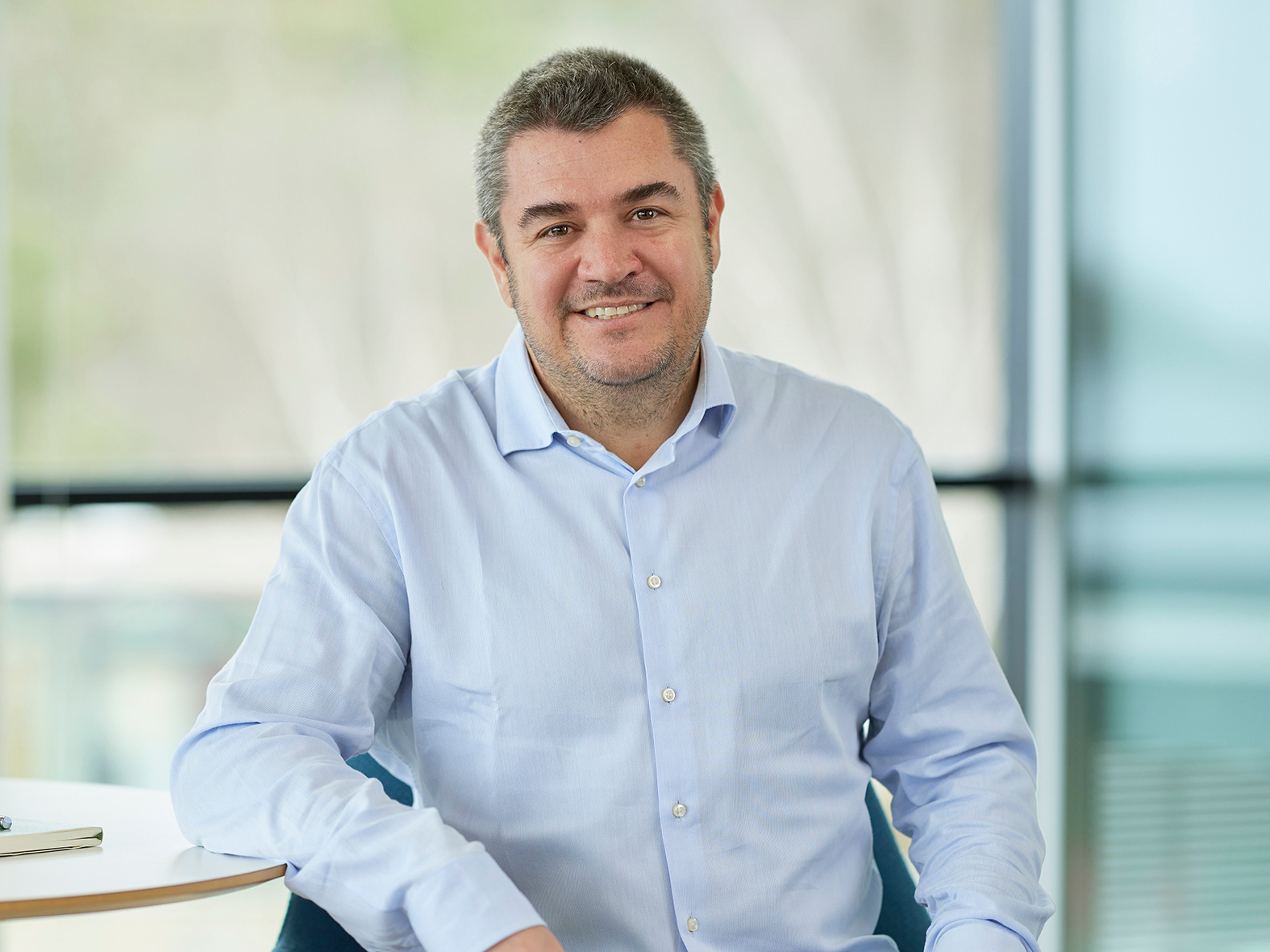 Chris Evdaimon sat while leaning against a table.