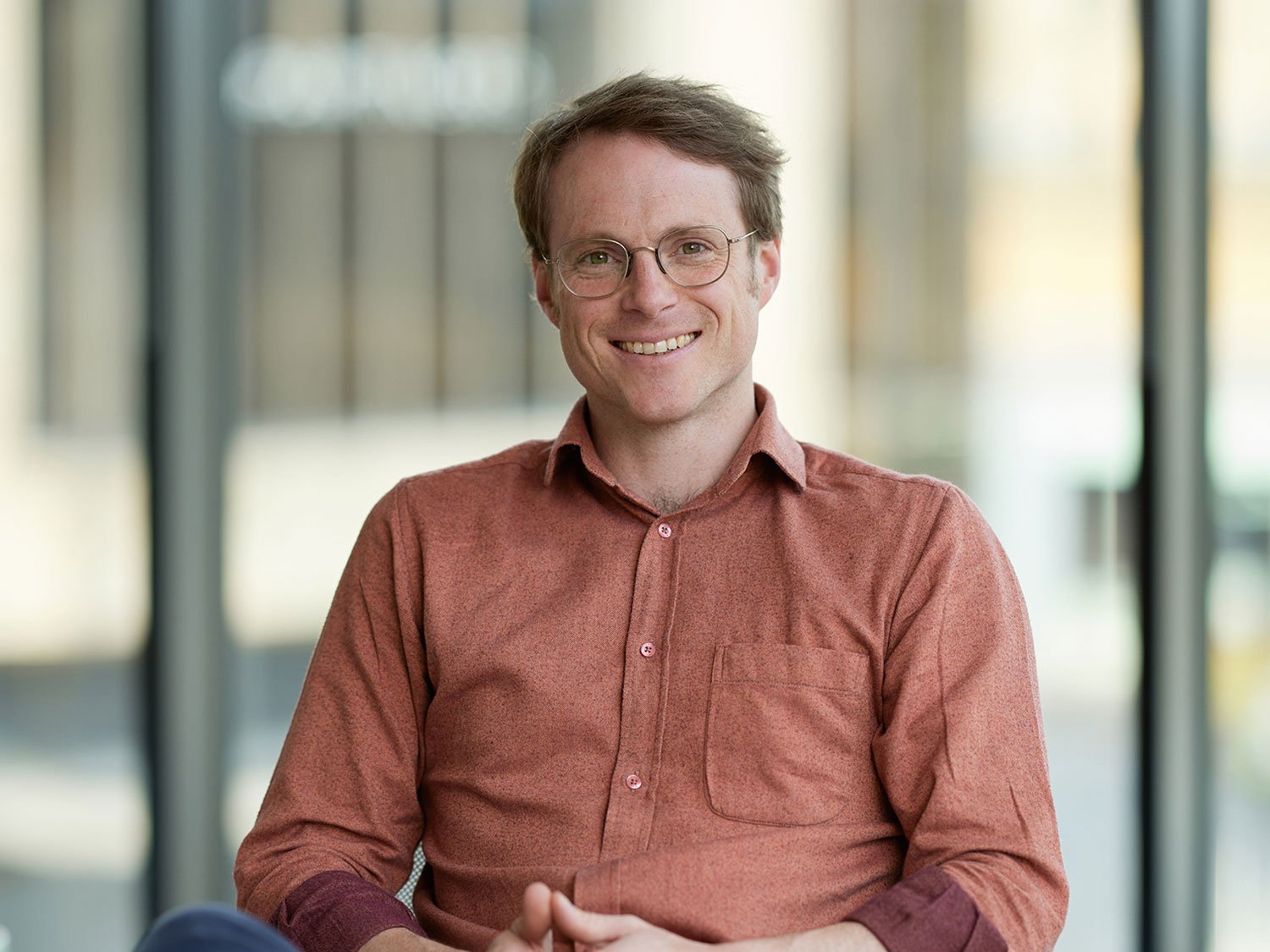 Peter Singlehurst sitting with his hands clasped.