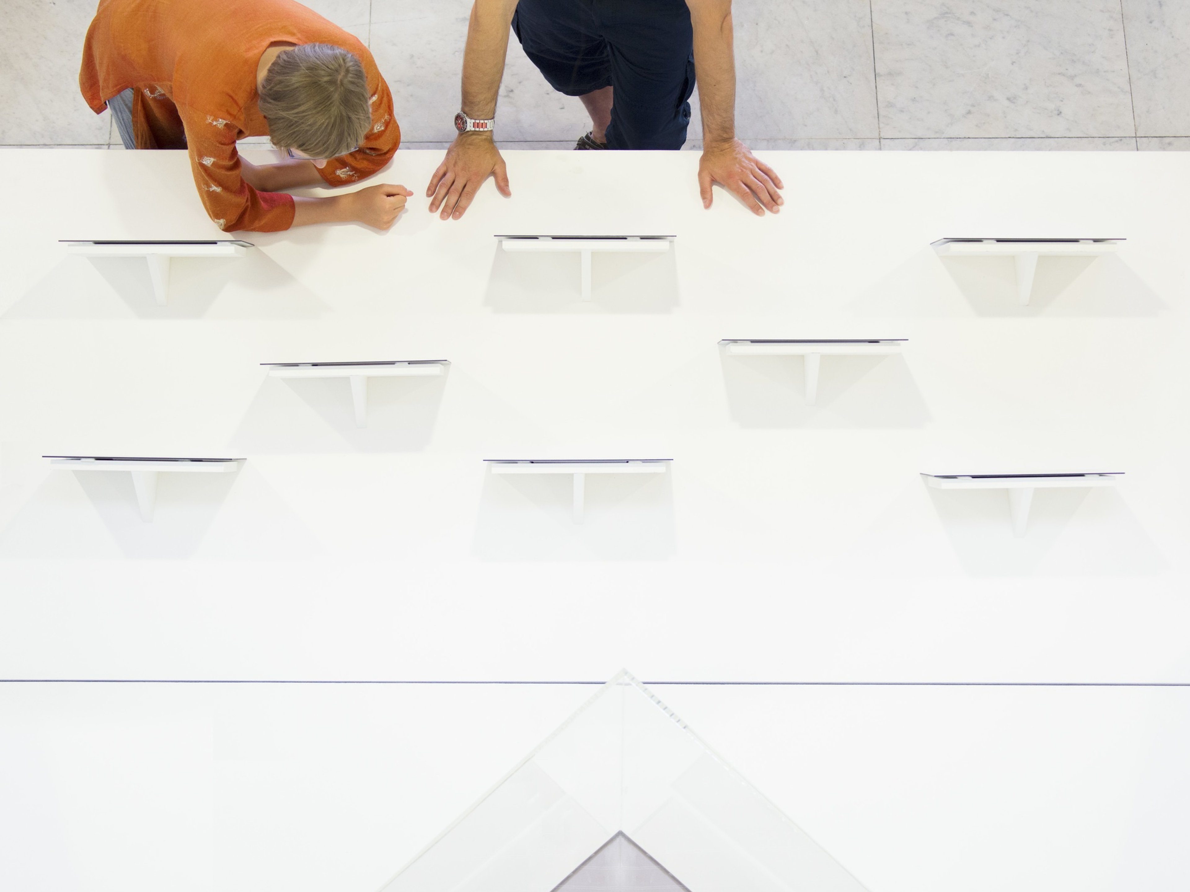 Aerial view of people looking at tablets