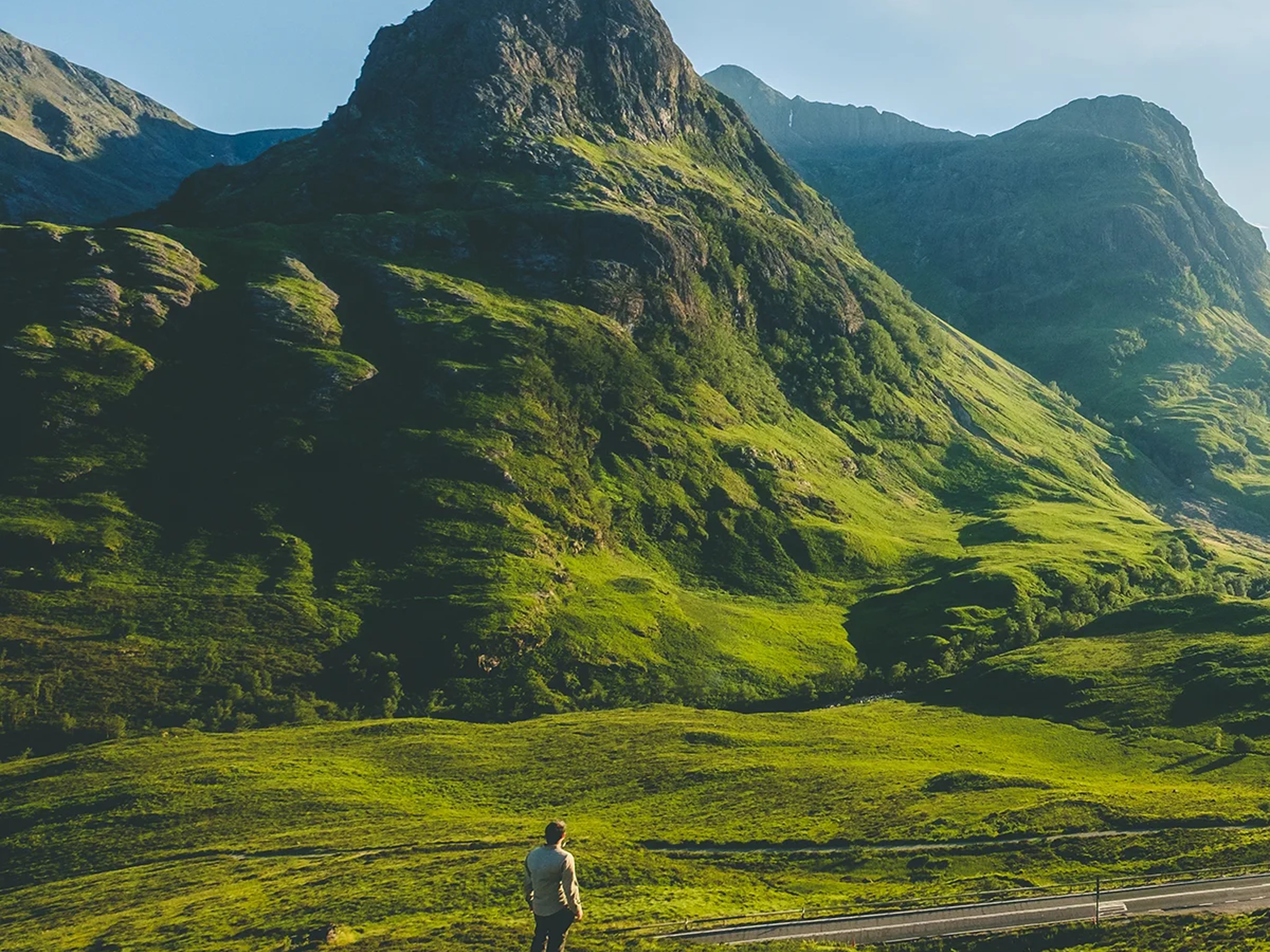 A person views the peaks of Glencoe, Scotland