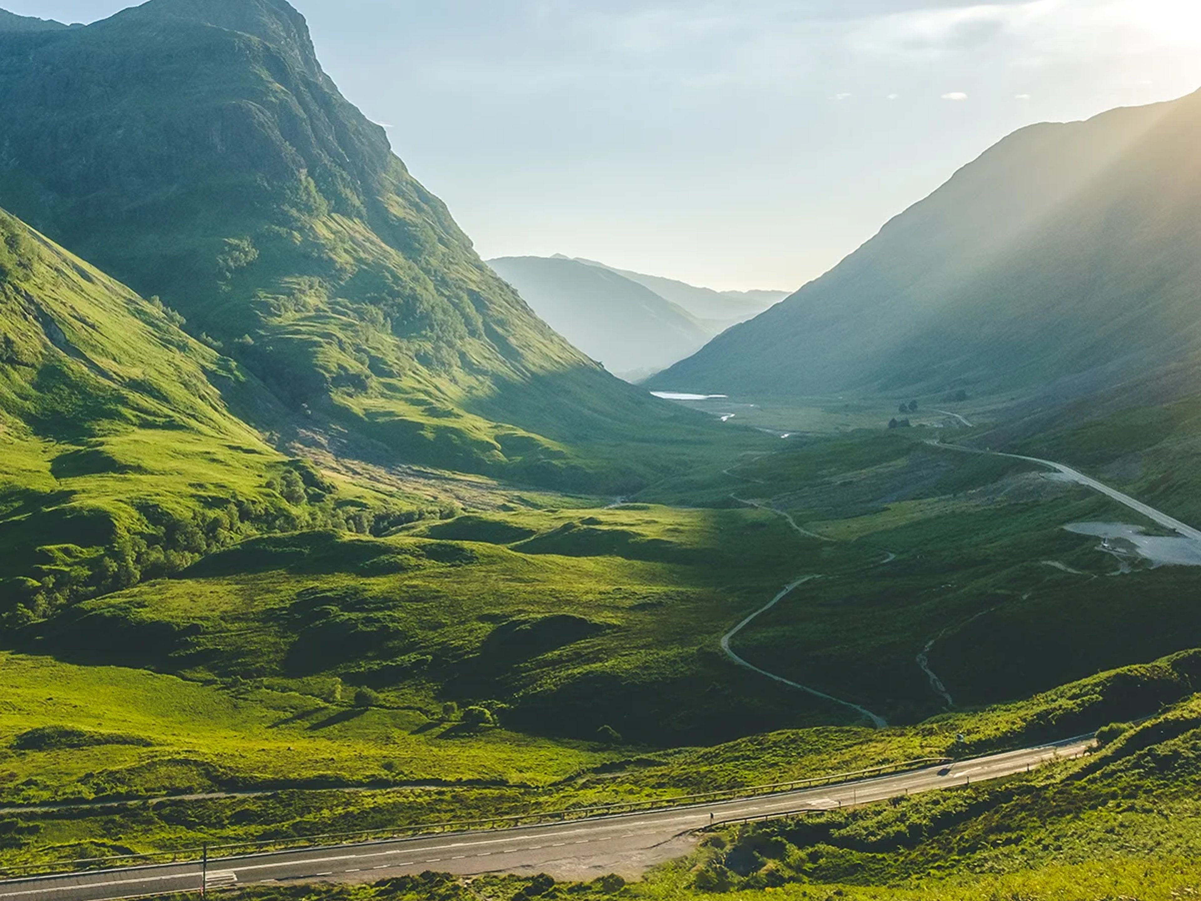 The sun shines through Glencoe, Scotland
