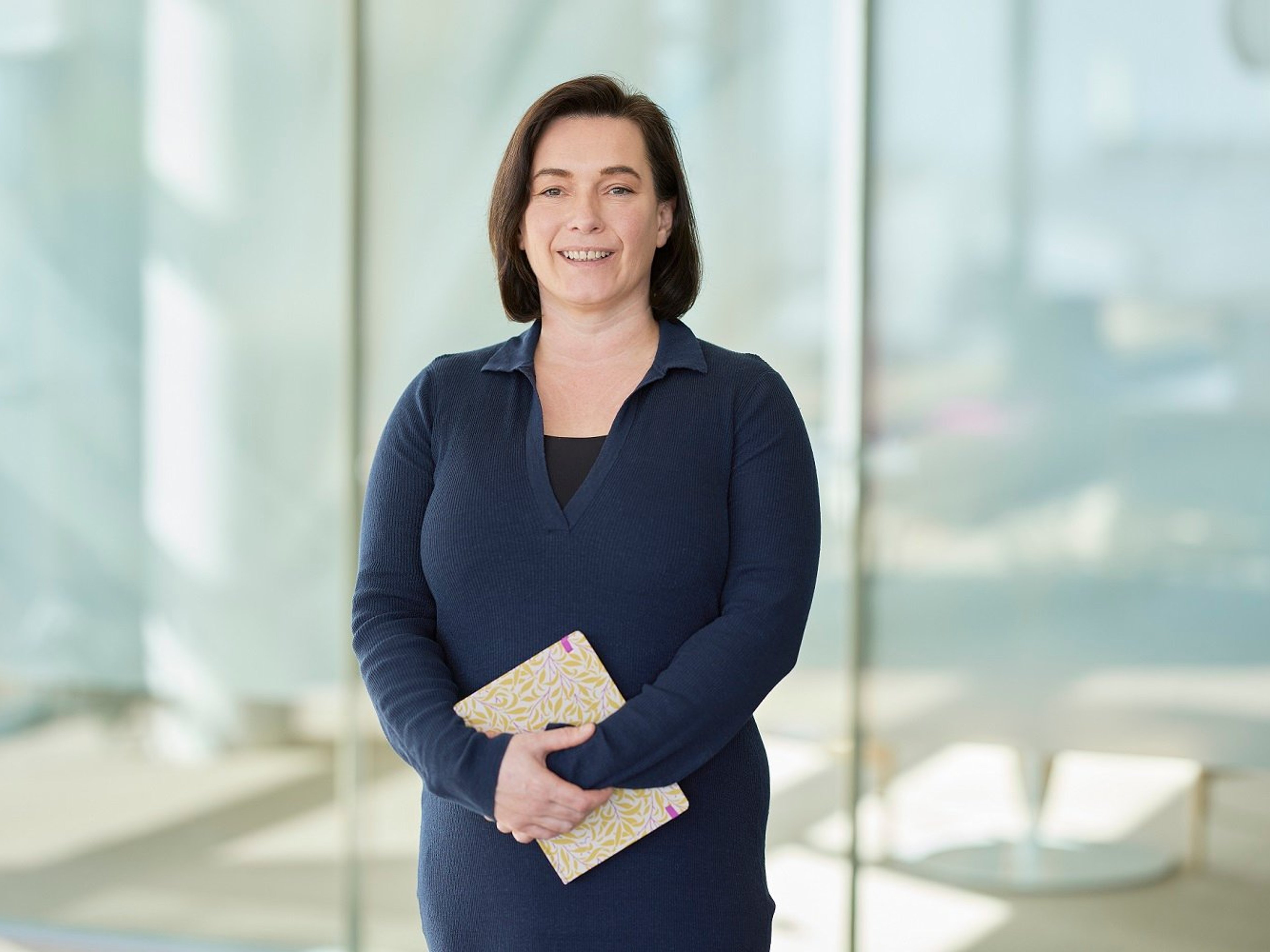 Kathrin Hamilton standing in Baillie Gifford office
