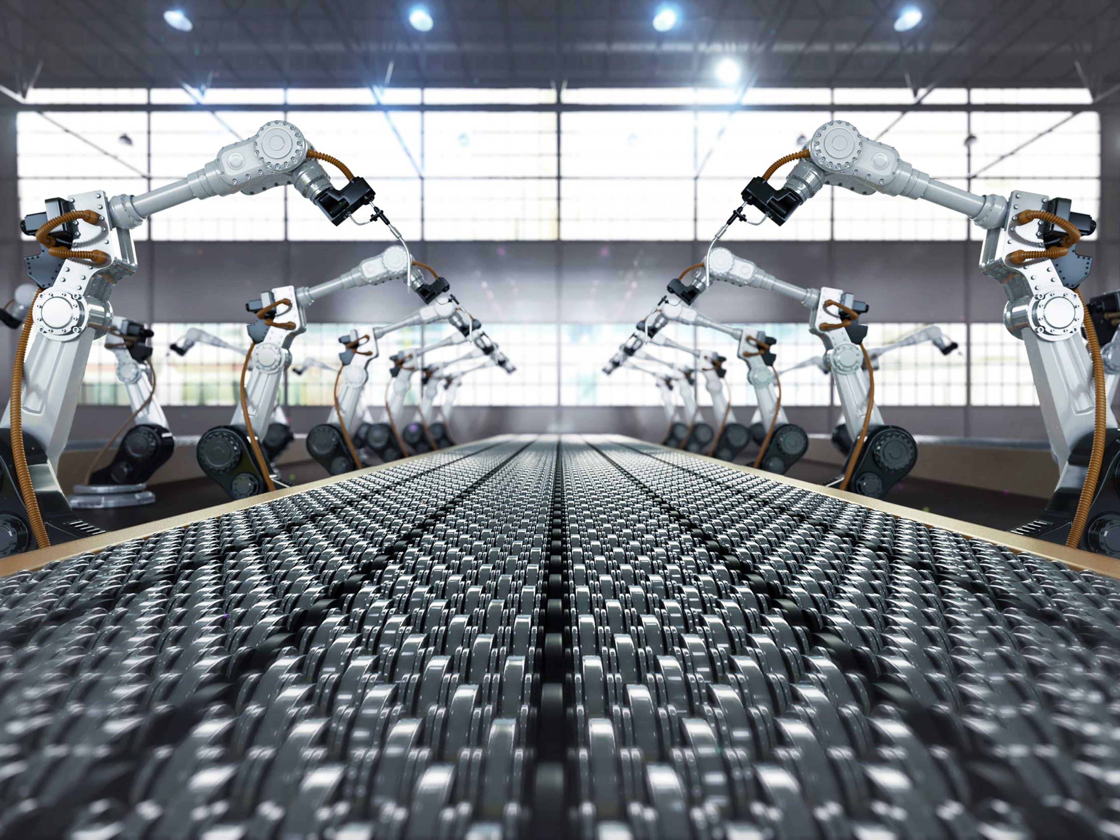 Robotic arm welding in a futuristic assembly automotive manufacturing plant.