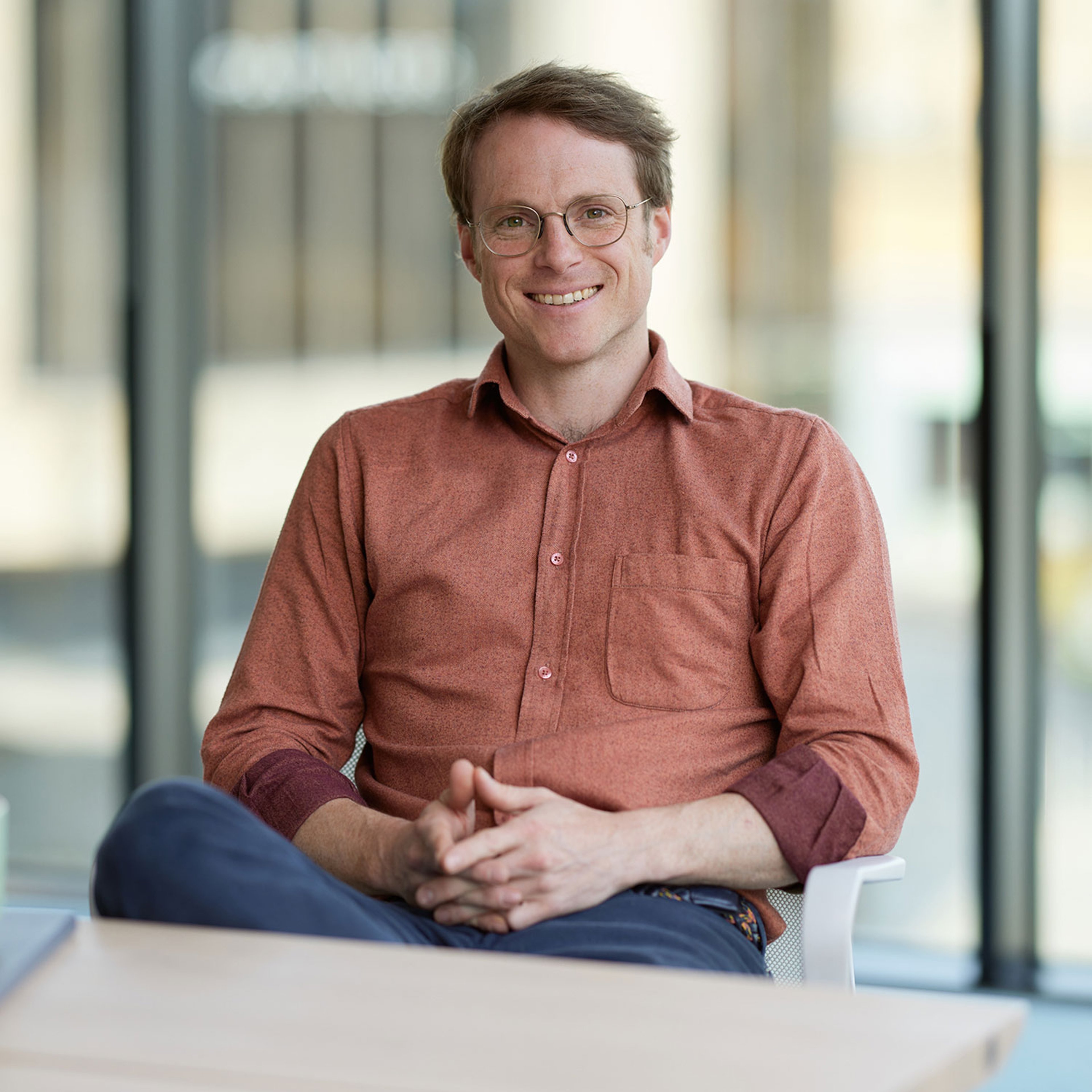 Peter Singlehurst sitting with his hands clasped.