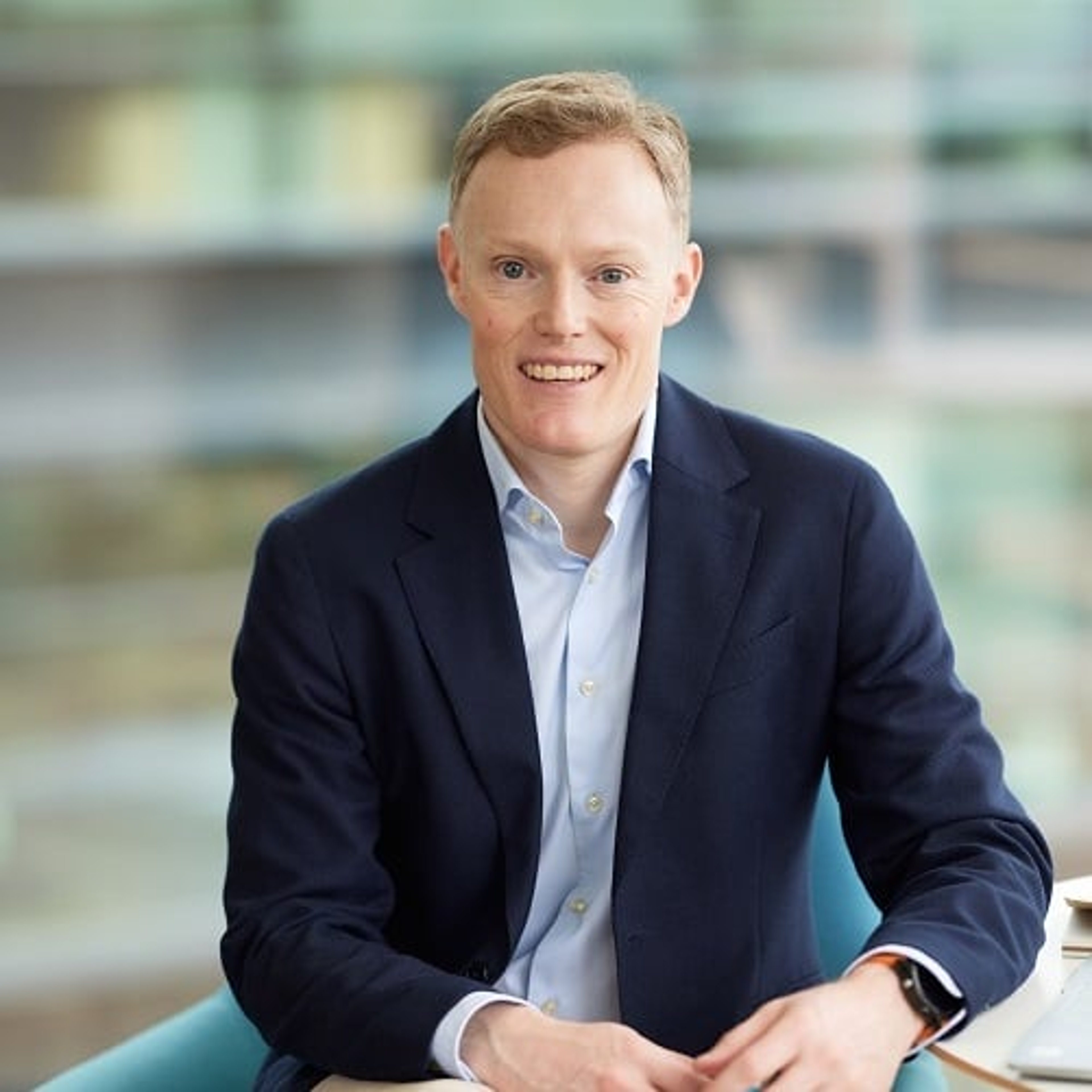 Chris Murphy sitting at a table in the Baillie Gifford office.