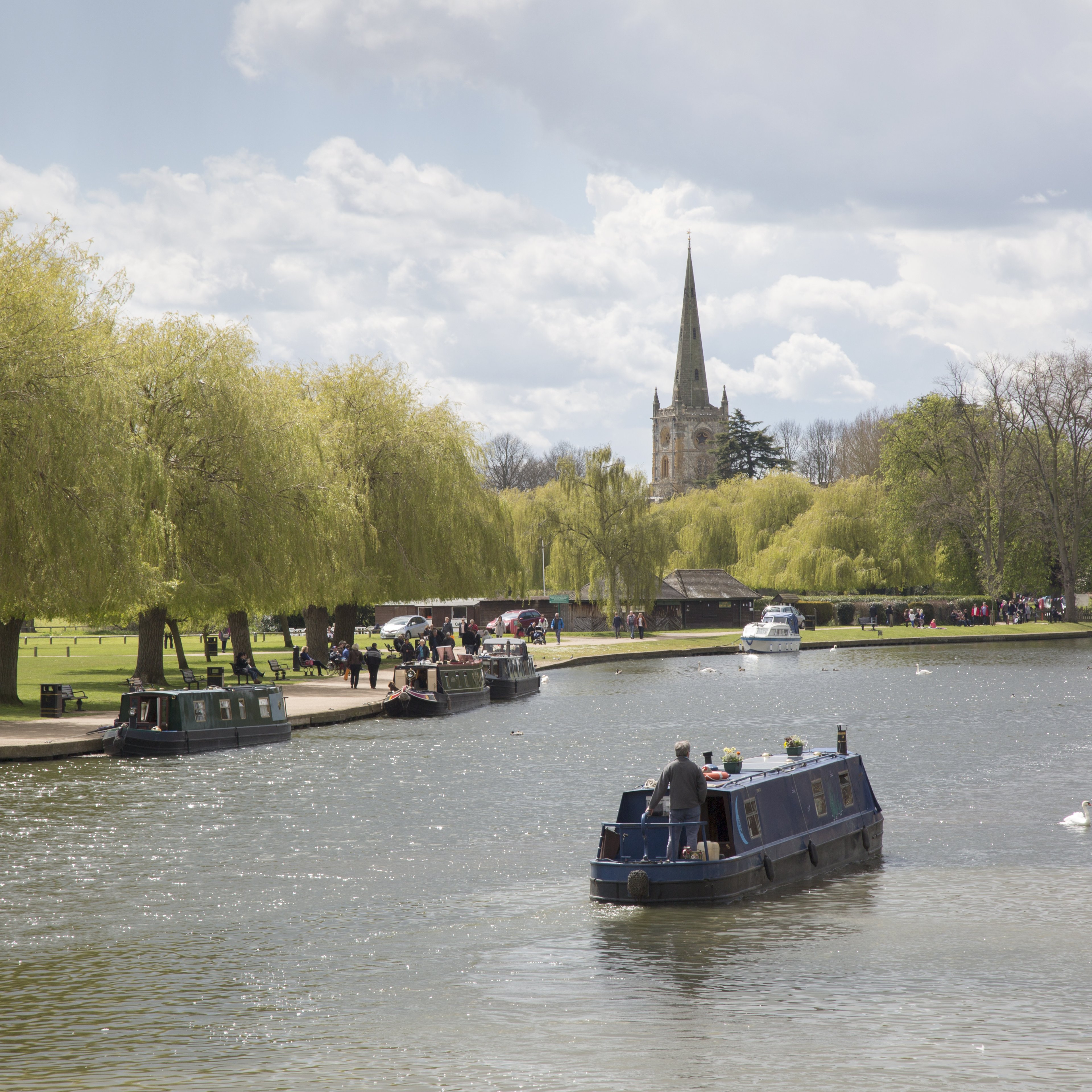 Narrowboats on the river Avon with the catherdral in the background.