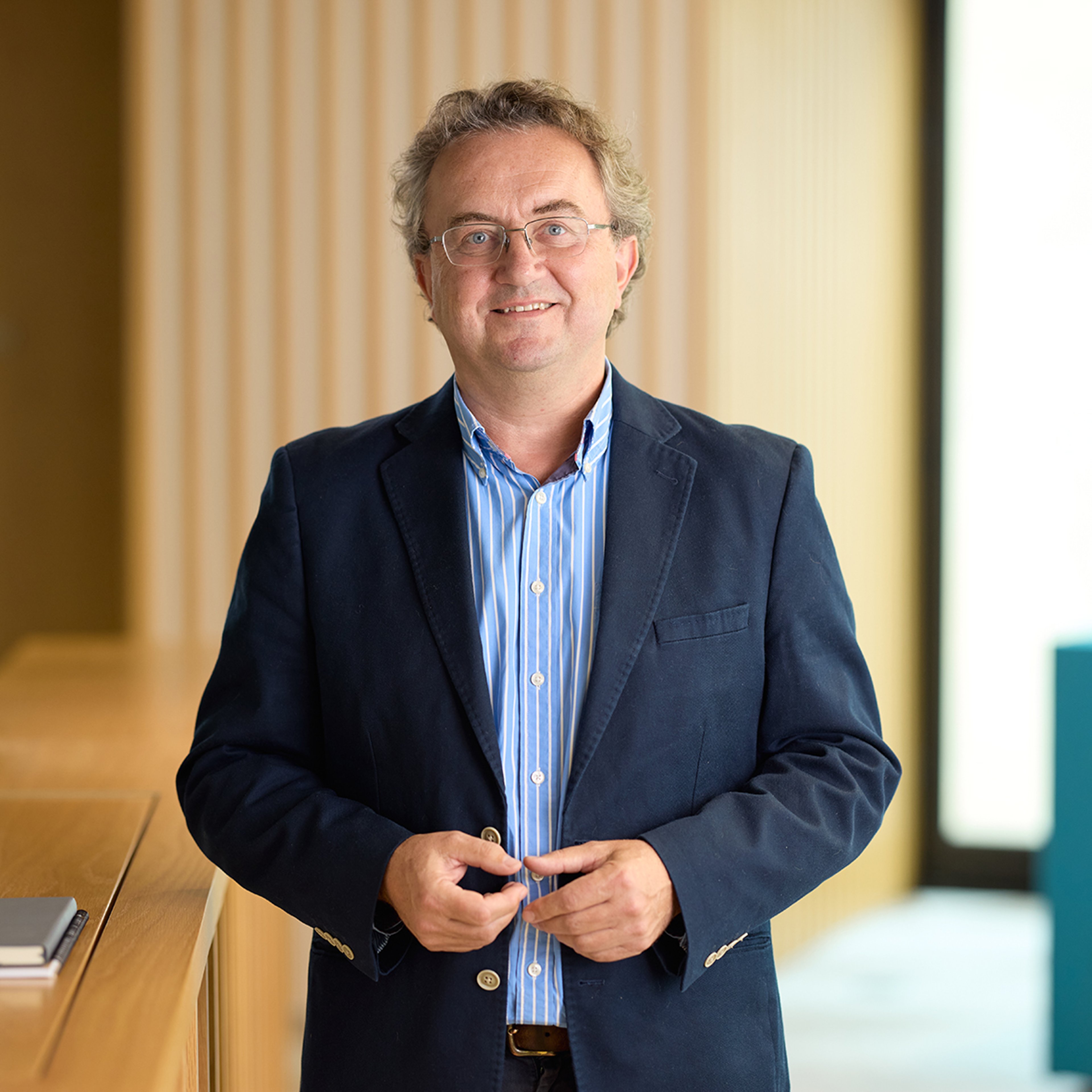 Anthony Dickson standing in the Baillie Gifford office.